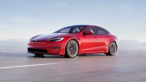 Red 2021 Tesla Model S Rolling Shot of Front Driver Side Fender