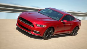 2016 Ford Mustang GT Equipped with the Black Accent Package driving on banked high speed course