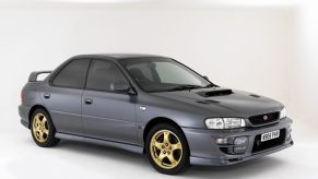 A gray 2000 JDM Subaru Impreza WRX STi in a white studio