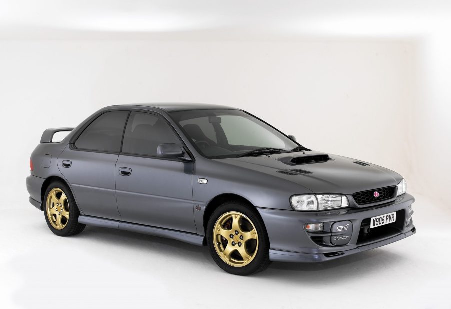 A gray 2000 JDM Subaru Impreza WRX STi in a white studio