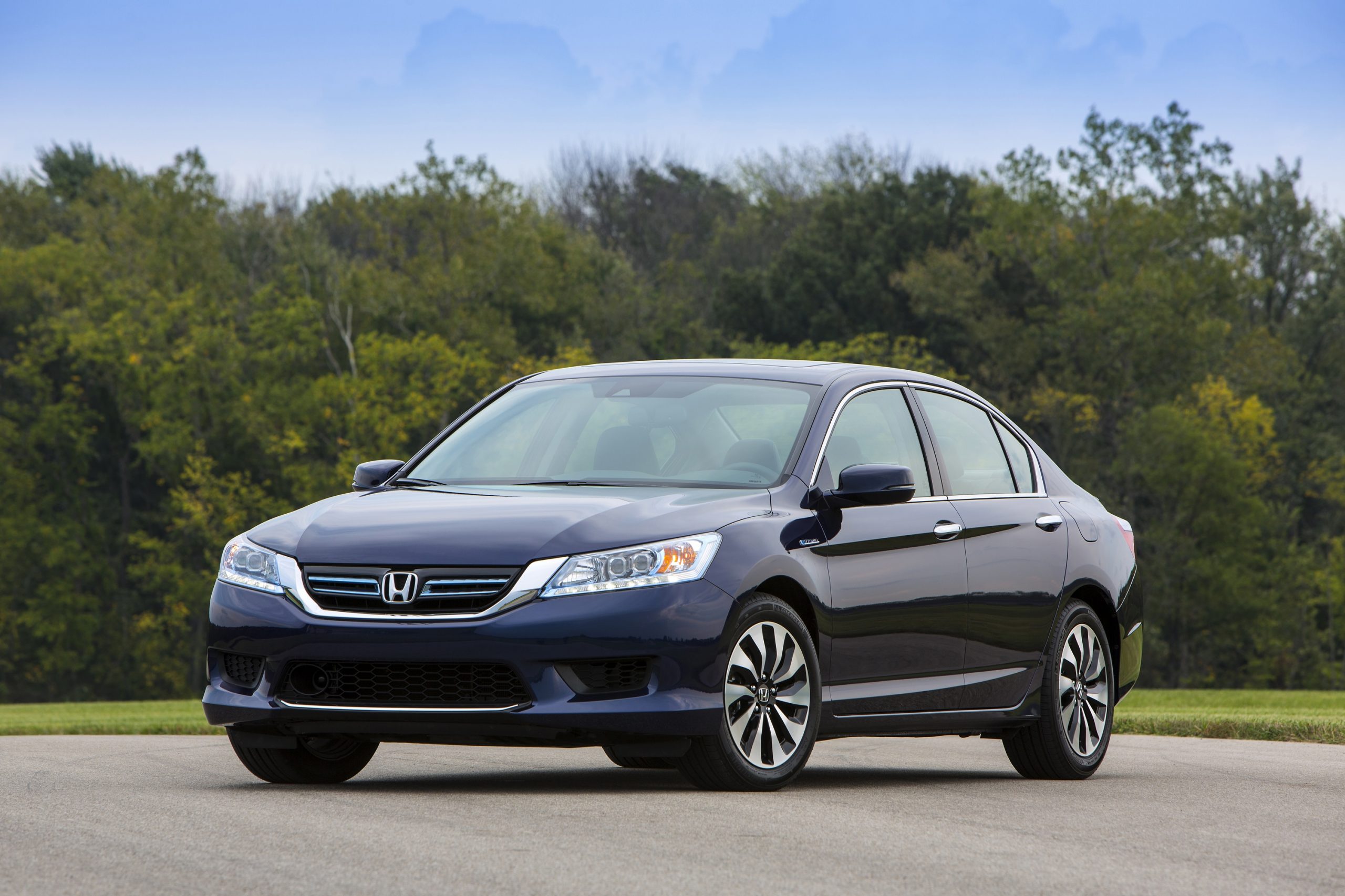 A 3/4 shot of a dark blue Honda Accord Hybrid