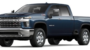 A dark blue 2022 Chevy Silverado 2500HD against a white background.