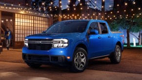 A blue 2022 Ford Maverick small pickup truck is parked outside.