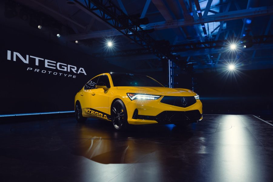 A yellow 2023 Acura Integra shot from the front 3/4