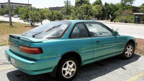 A 1993 Acura integra in aztec green pearl