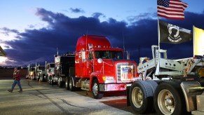 Truckers and supporters gather before departing for Washington, D.C., to protest COVID-19 mandates on February 22, 2022