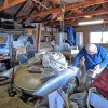 Bill Shelley with his 'Bali Hi' 1957 Chevrolet Corvette in his garage