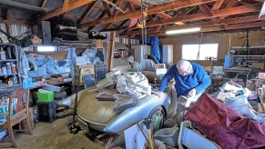 Bill Shelley with his 'Bali Hi' 1957 Chevrolet Corvette in his garage