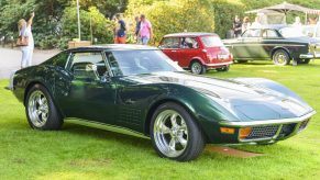 A dark green C3 Chevrolet Corvette shot from the front 3/4