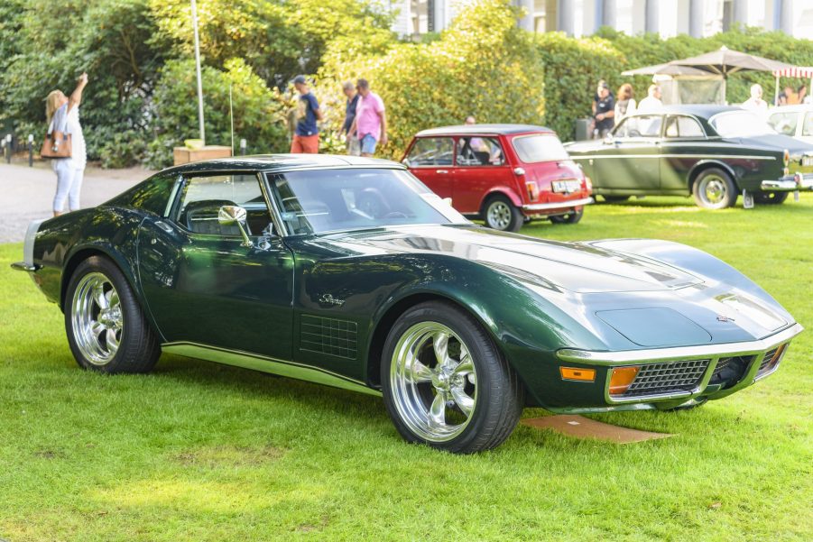 A dark green C3 Chevrolet Corvette shot from the front 3/4