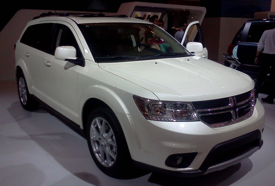 The Dodge Journey is featured on a showroom floor.