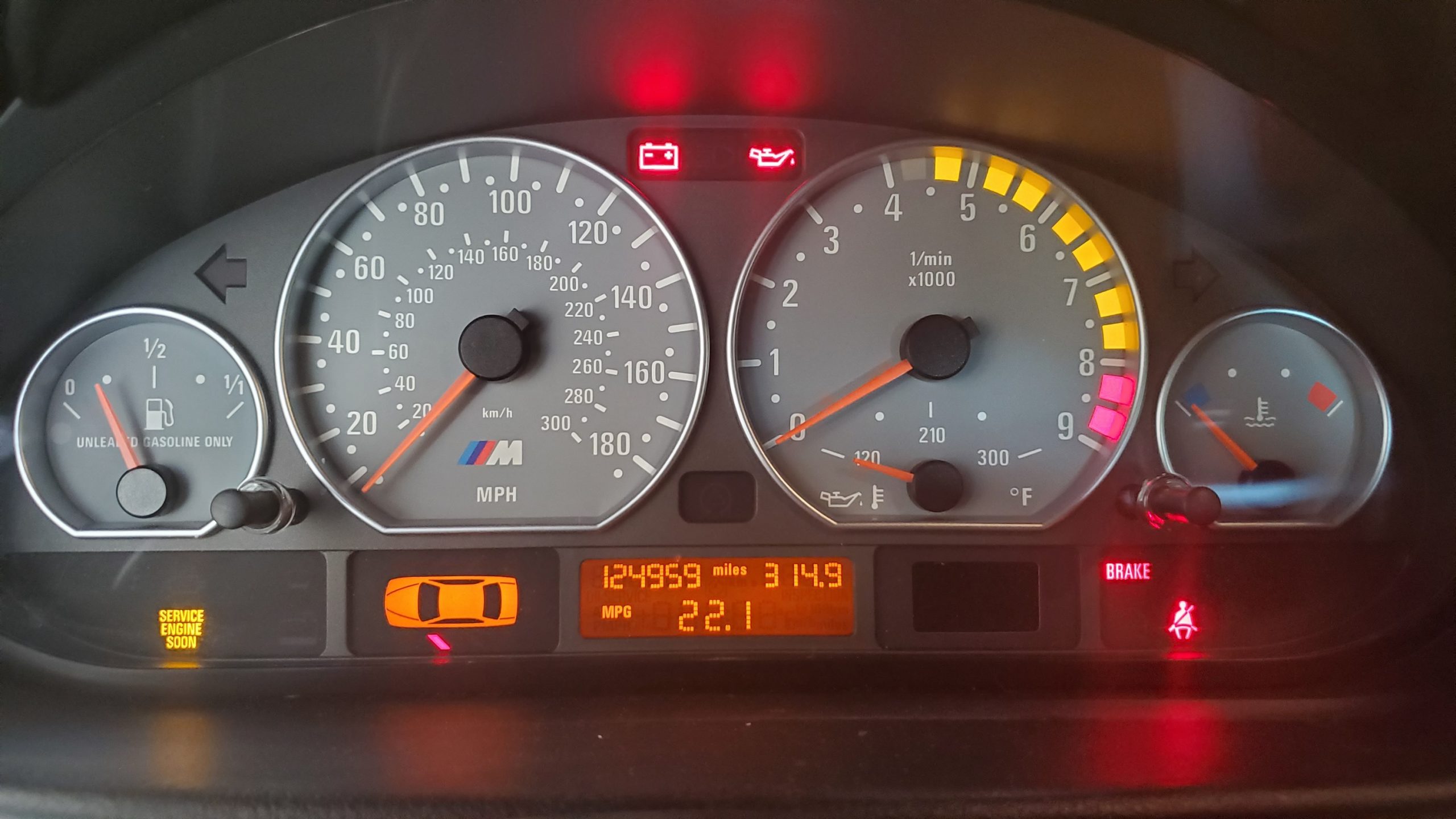 The gauge cluster of an E46 BMW M3 showing 22.1 MPG