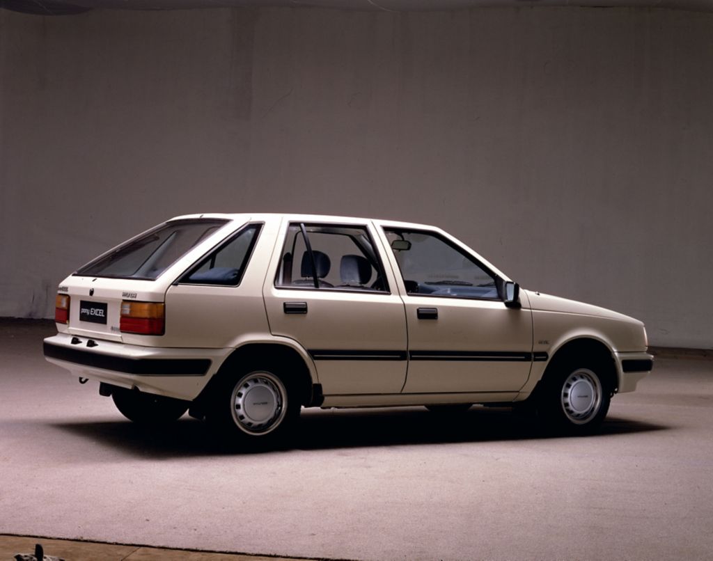 A brown Hyundai Excel.