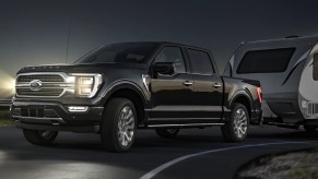 A black 2022 Ford F-150 against a night sky.