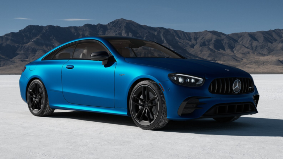 Fully loaded new blue 2022 Mercedes-Benz AMG E 53 Coupe with mountains in the background