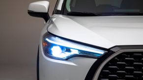 Headlight and signal lights on a white 2022 Toyota Corolla Cross