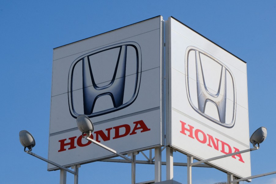 A large sign advertising the Honda brand.