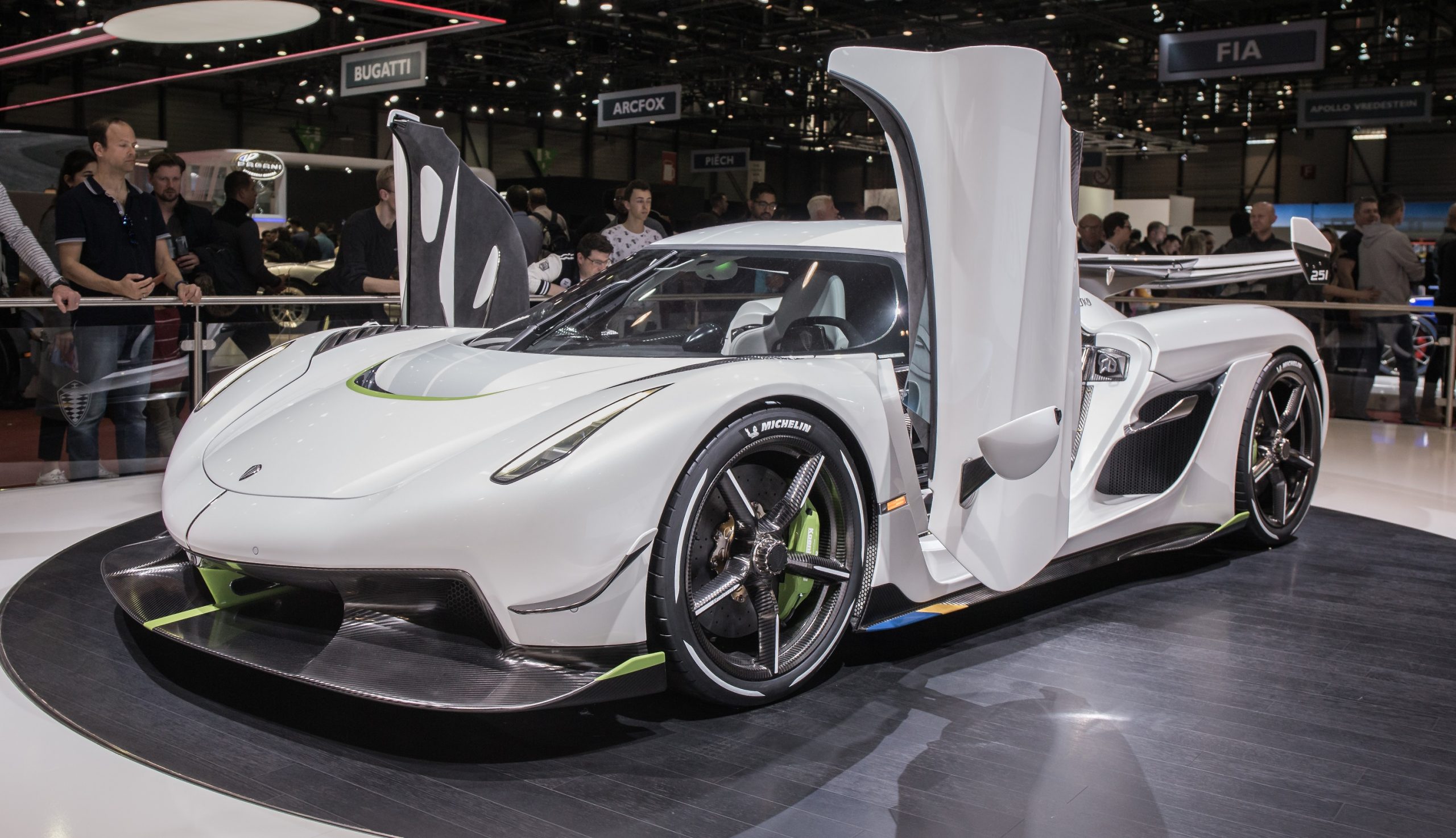 A white Koenigsegg Jesko supercar shot from the front 3/4 at the Geneva Motor Show