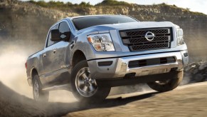 Light Blue 2022 Nissan Titan going up a hill