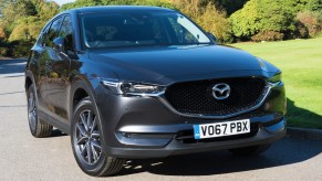 A gray Mazda CX-5 compact SUV is parked.