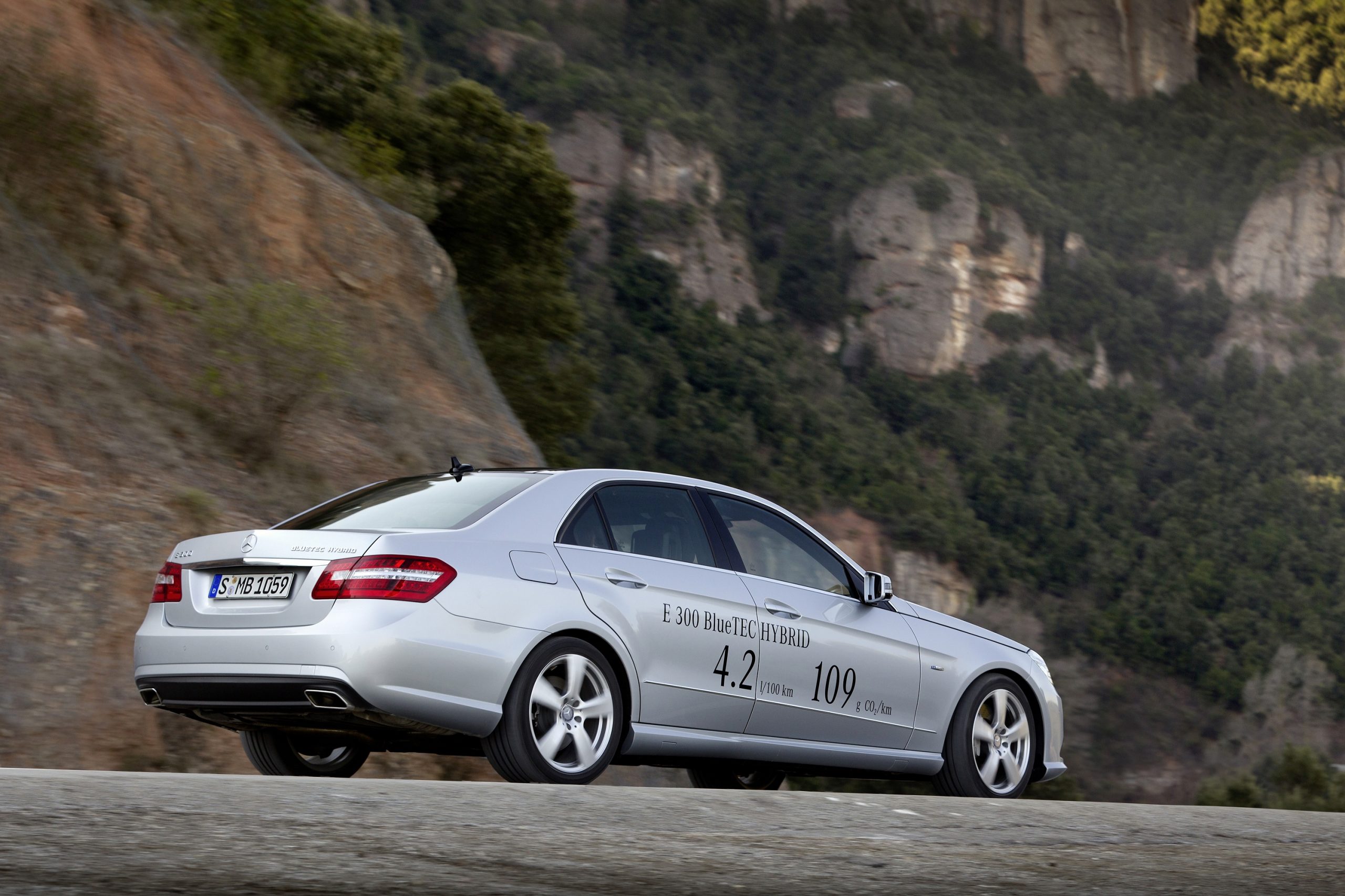 A silver Mercedes-Benz E Class sedan with a BlueTec hybrid powerplant