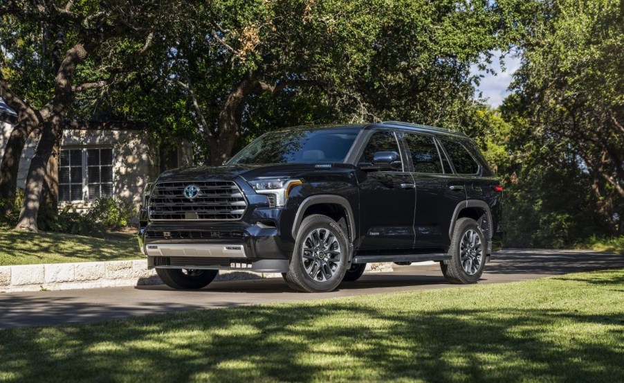 Midnight Black Metallic 2023 Toyota Sequoia parked near some trees