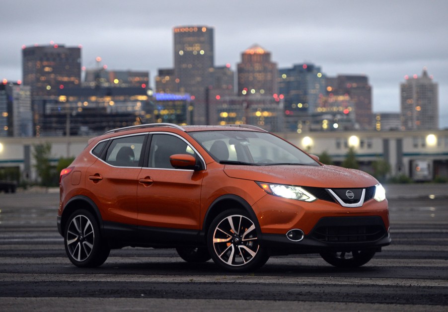 The Nissan Rogue sets in front of a city scape.