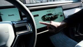 The interior of the Rivian R1T electric pickup truck where Gear Guard can be activated and used on the touchscreen