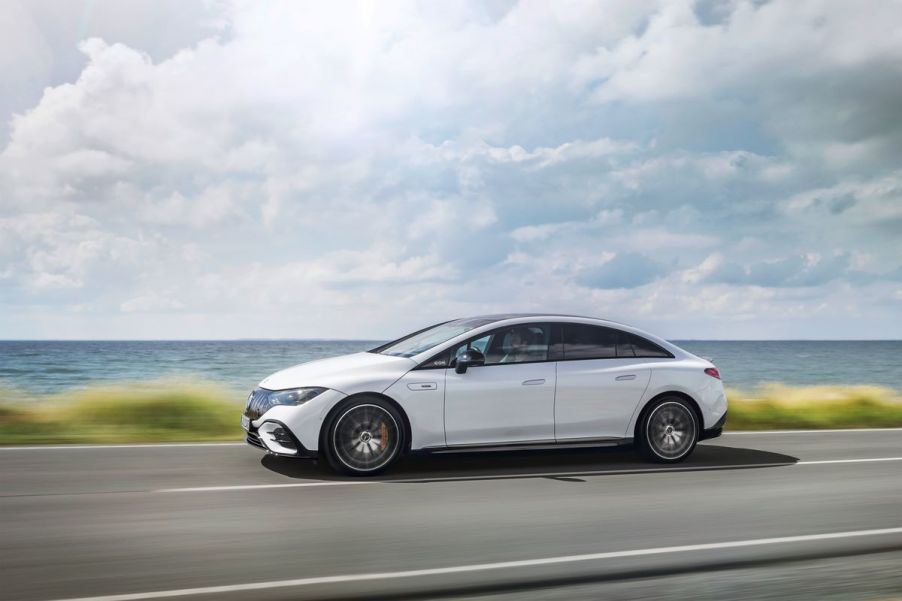 Side view of white 2023 Mercedes-AMG EQE, highlighting its release date and price