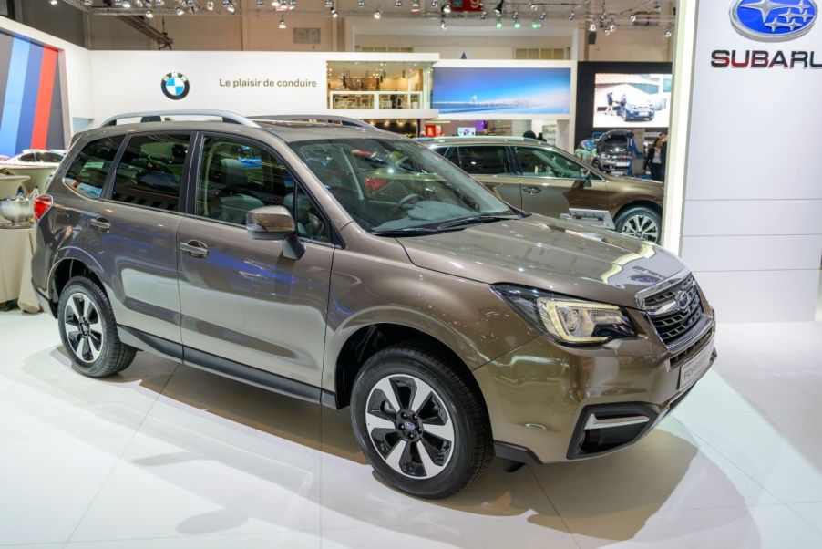 A beige Subaru Forester parked indoors.