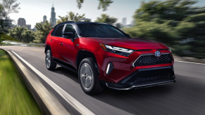 Supersonic Red 2022 Toyota RAV4 Prime with the Chicago skyline in the background