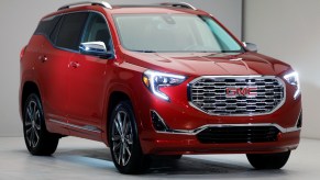 A red GMC Terrain small SUV is on display.