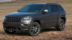 A gray Jeep Grand Cherokee is parked outdoors.