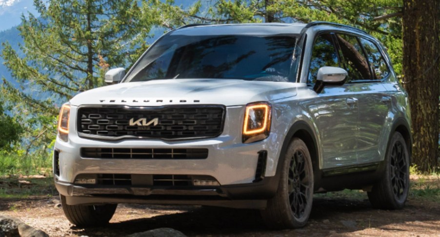 The Kia Telluride is parked outdoors.