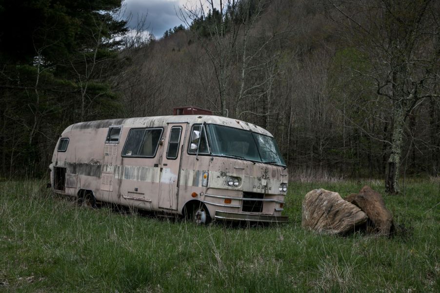 Abandoned Dodge van and other cars found throughout the woods and downtown area in Asheville, North Carolina