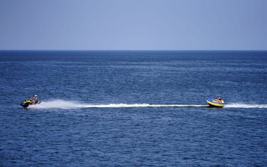 People tubing and being pulled by a jet ski in Zelenogradsk, Kaliningrad, Russia