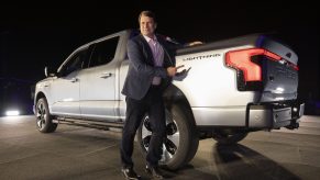 Jim Farley, the CEO of Ford, poses with the F-150 Lightning