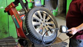 A tech fills up a tire with air