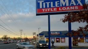 A TitleMax store sign on the side of the road.