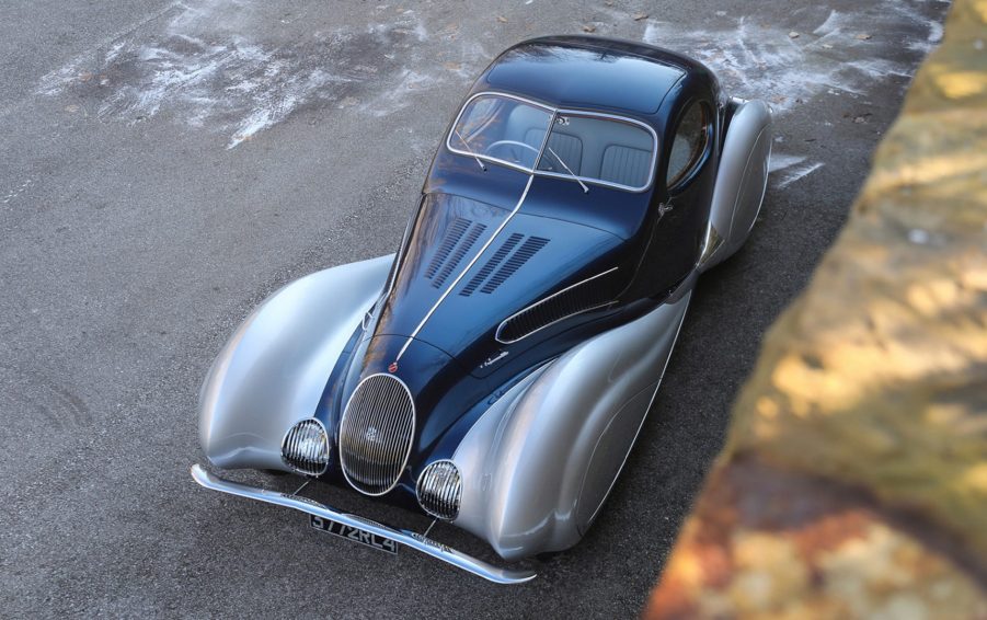 The blue-and-silver 1937 Talbot-Lago T150-C-SS Teardrop Coupe Chassis #90107 parked on a road