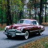 1949 Buick Roadmaster in red shot from front end on a forest road