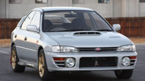 A silver 1994 JDM Subaru Impreza WRX STi in a parking lot