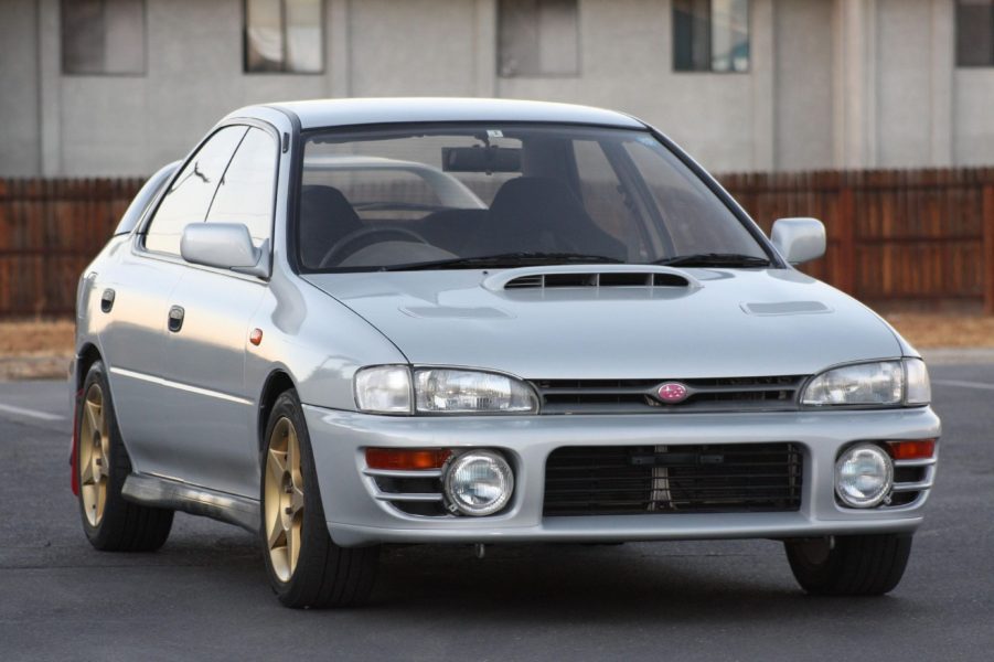 A silver 1994 JDM Subaru Impreza WRX STi in a parking lot