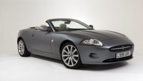 A gray 2007 Jaguar XK Convertible in a white studio