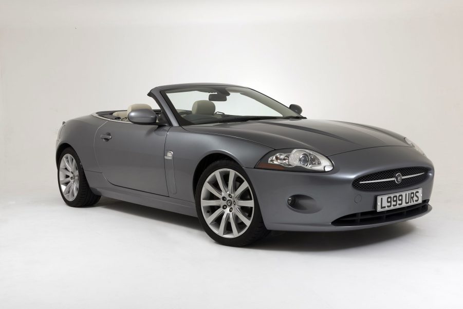 A gray 2007 Jaguar XK Convertible in a white studio