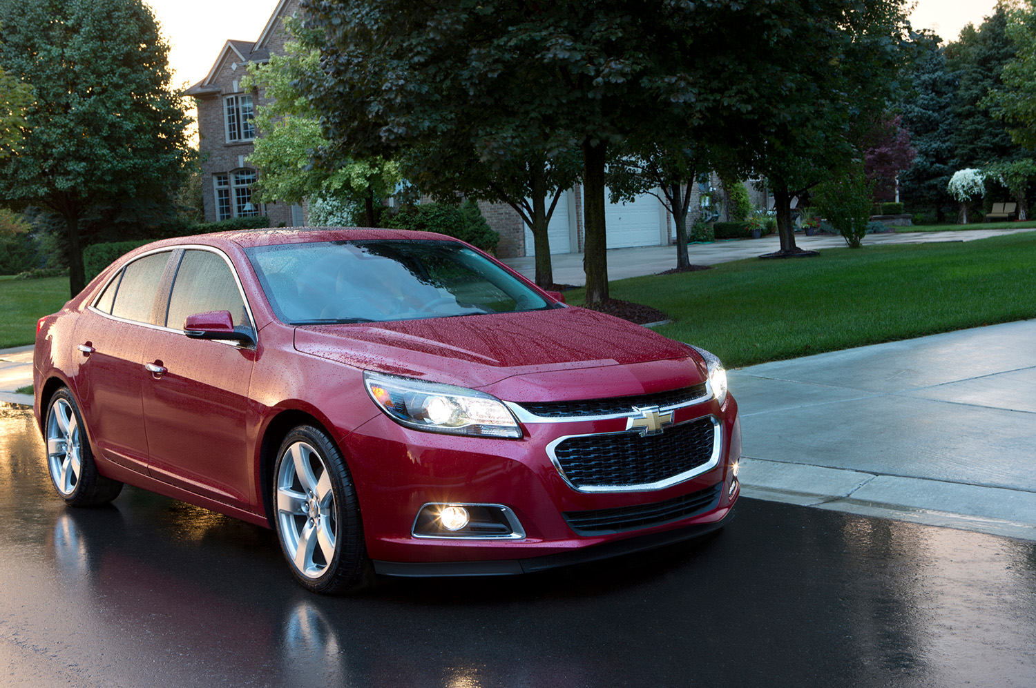 Red 2015 Chevrolet Malibu sedan front 3/4 shot in rain