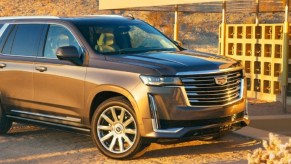 A taupe 2021 Cadillac Escalade at sunset.