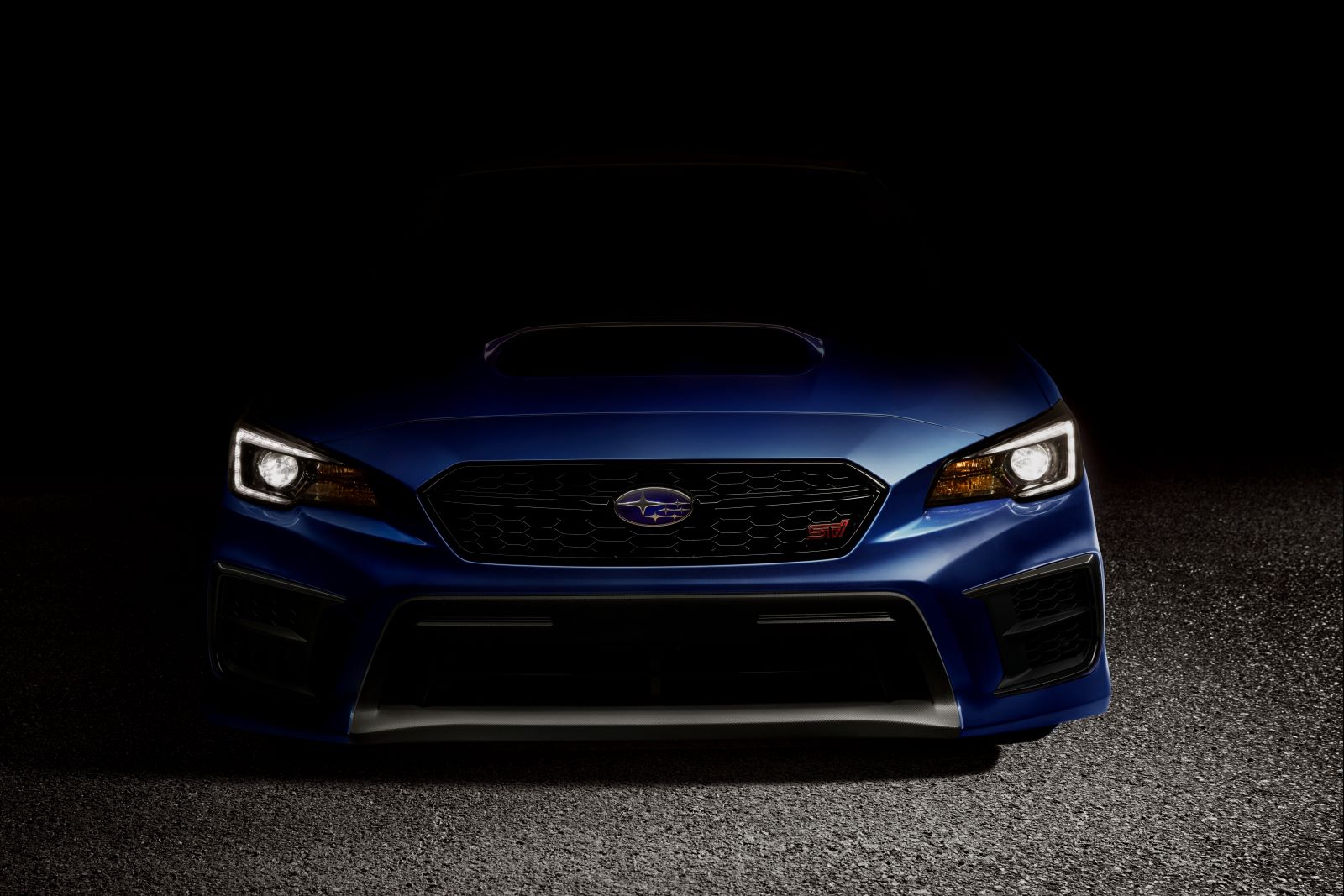 Close view of a blue 2021 Subaru WRX STI's front grille