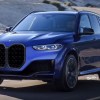 Blue 2022 BMW X5 luxury SUV on the road