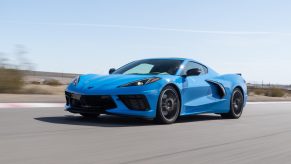 A blue 2022 C8 Chevrolet Corvette Stingray on a racetrack